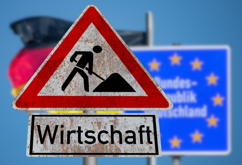 Flagge von Deutschland und Schild Baustelle Wirtschaft